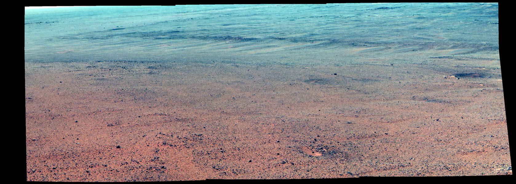 Mars - Snímek amerického robota Opportunity ukazuje povrch údolí na Marsu, zřejmě tvarovaný vodou