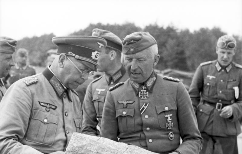 Field Marshall Erich von Manstein & General Erich Brandenberger on the Eastern Front studying a map.